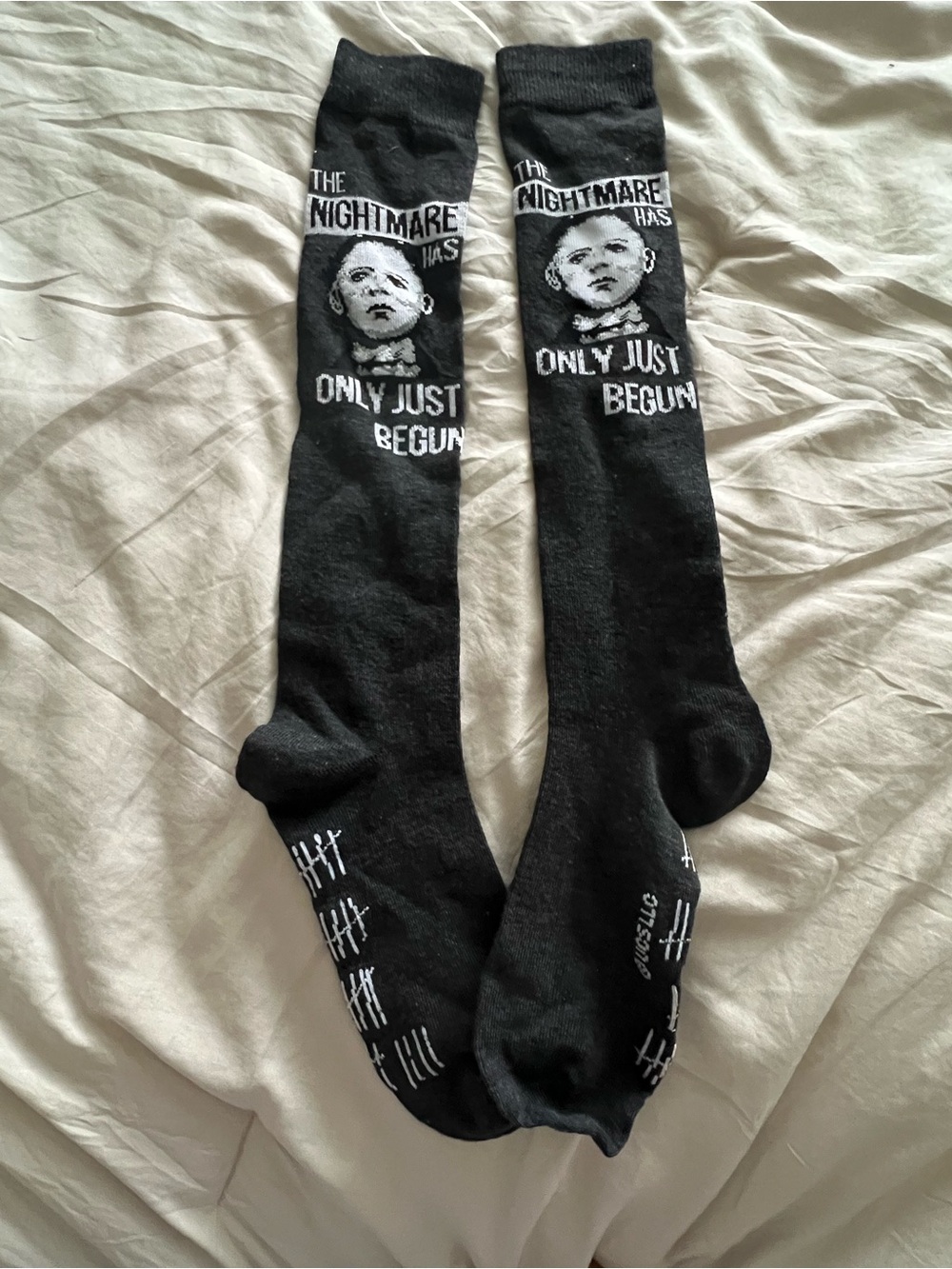 Black Graphic Knee-High Socks with 'The Nightmare Has Only Just Begun' Text